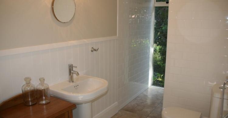 Tiled ensuite bathroom with character fittings