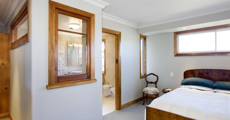 Master bedroom with recyled feature windows